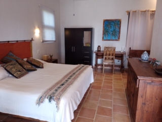 King bed in studio apartment